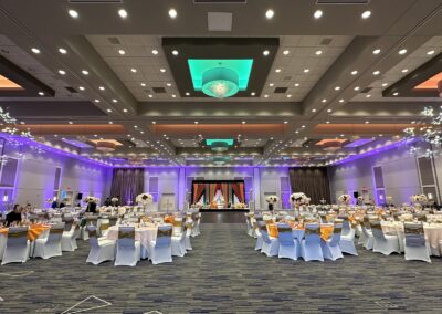 Olathe Conference Center set up for a fancy wedding with bouquets of flowers at each table